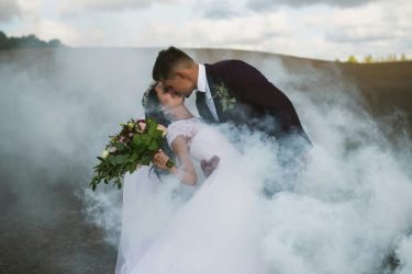 groom and bride kissing